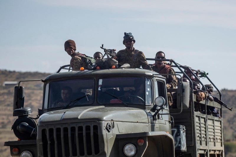 Ethiopian government soldiers ride in the back of a truck on a road near Agula, north of Mekele, in the Tigray region of northern Ethiopia on May 8, 2021 (AP Photo)