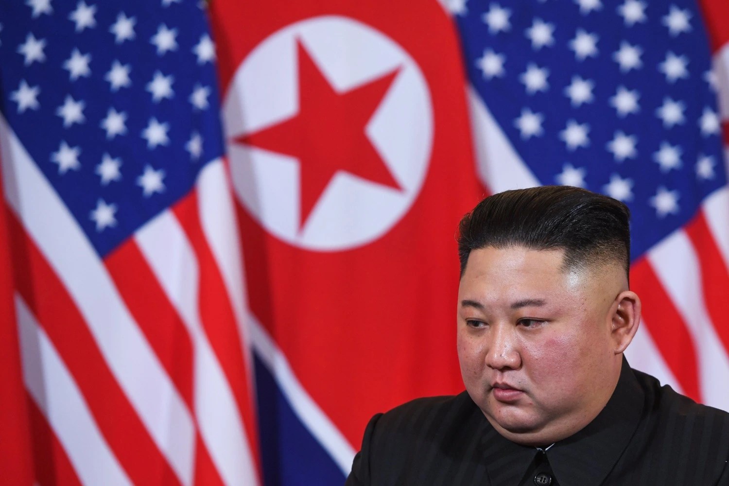 North Korea's leader Kim Jong Un listens to US President Donald Trump (not pictured) during a meeting at the Sofitel Legend Metropole hotel in Hanoi on February 27, 2019. ( SAUL LOEB/AFP VIA GETTY IMAGES)