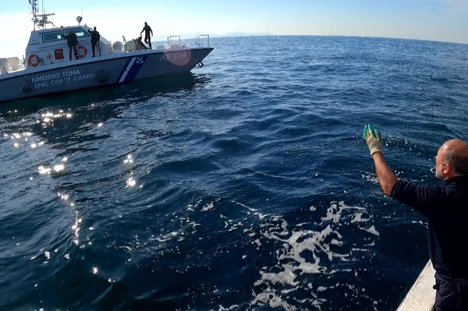 A scene from the video footage shows Turkish fisherman being confronted by the Greek coast guard, February 3, 2022 (AA).