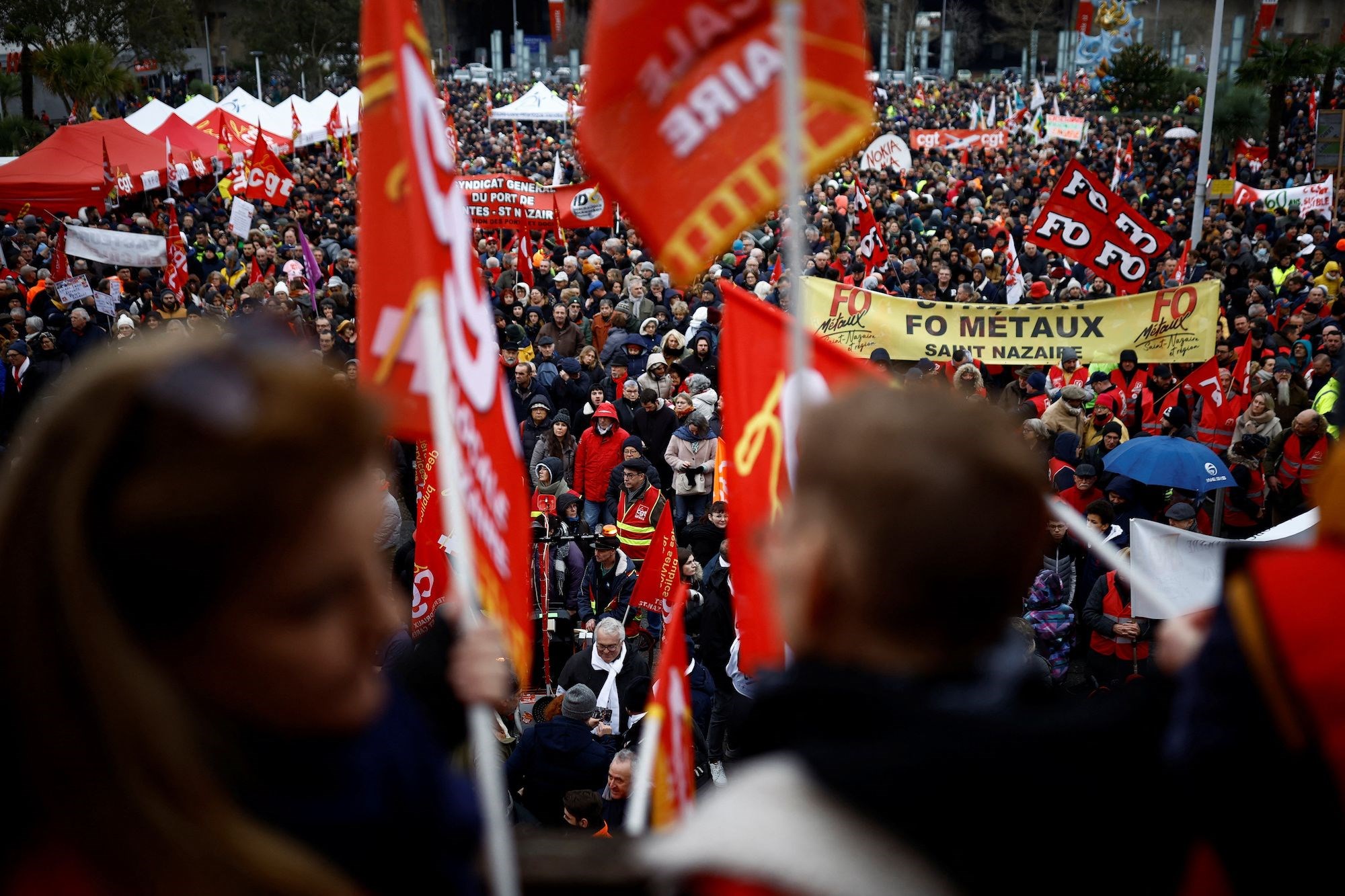 French protesters demonstrate against the government's pension reforms in Saint-Nazaire as part of the nationwide strikes (Reuters)