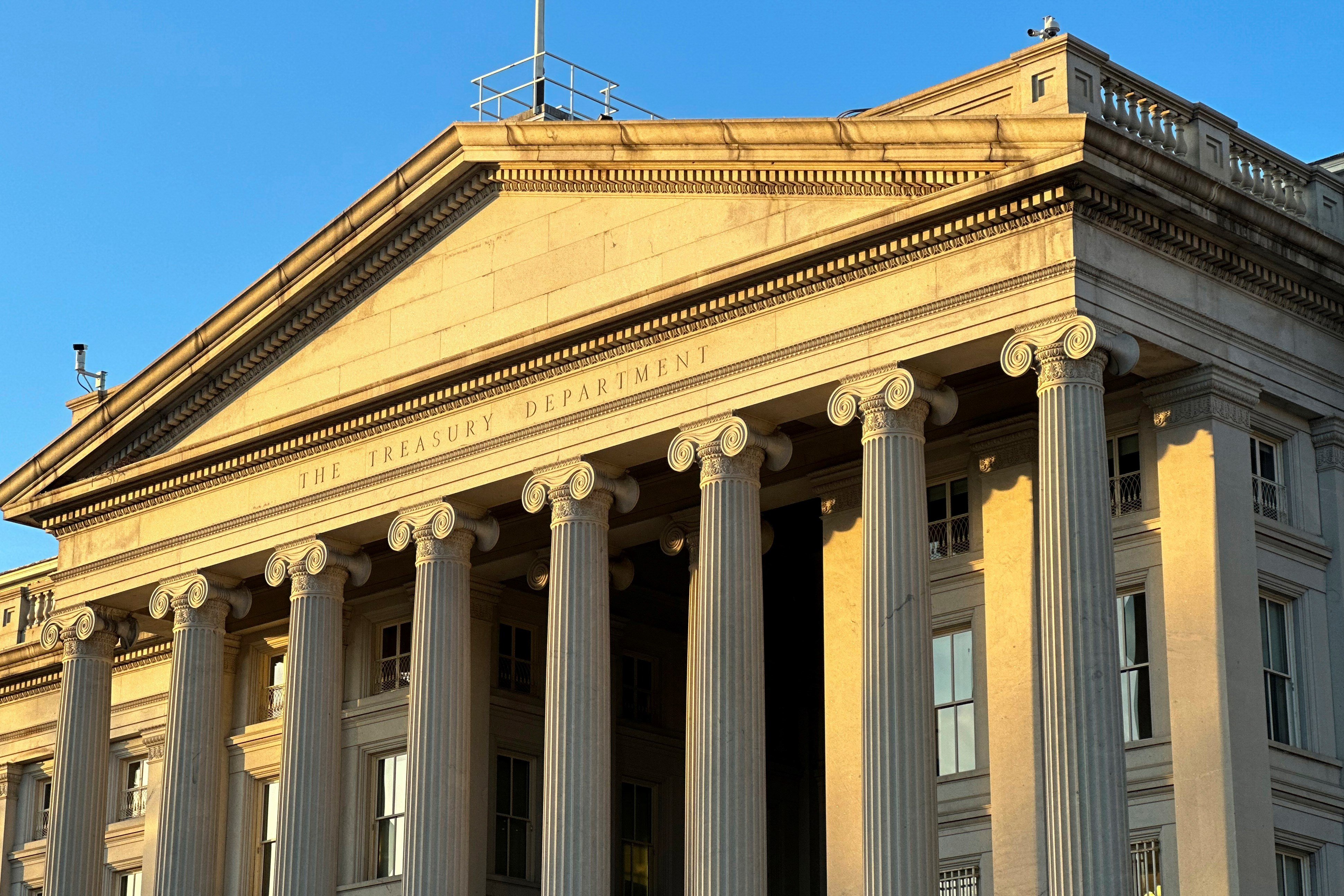 The Treasury Department is seen near sunset in Washington, Wednesday, Jan. 18, 2023 (AP Photo/Jon Elswick)