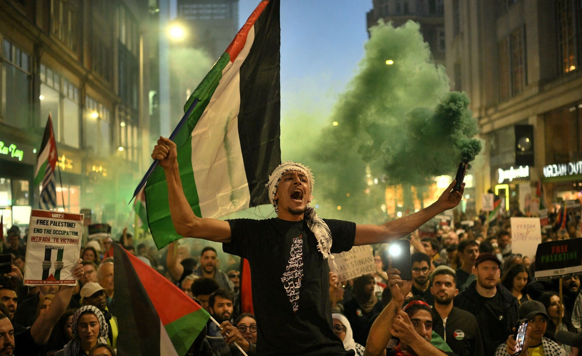  Waving Palestinian flag, chanting from river to sea, an offense in UK