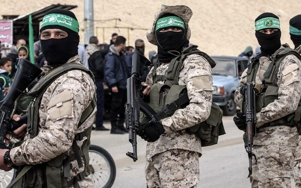 Members of the al-Qassam Brigades, the Hamas military wing, attend a memorial in the southern Gaza Strip town of Rafah on January 31, 2017, (AFP)
