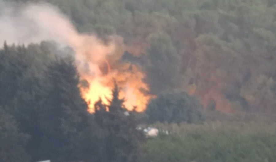 An Israeli armored vehicle catches on fire across the Lebanese borders with occupied Palestine, October 10, 2023 (Social media)