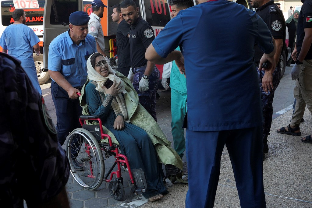 Palestinians wounded in Israeli air strikes on Gaza Strip are brought to al-Aqsa hospital in Deir el-Balah, Gaza Strip, Saturday, Oct. 14, 2023 (AP Photo/Adel Hana)