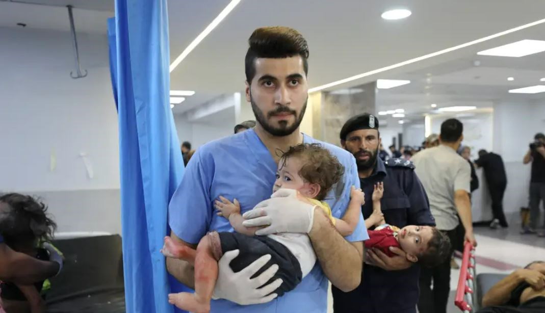 An injured Palestinian children by Israeli occupation airstrikes transferred to Shifa Hospital in Gaza City on October 11. (AP)