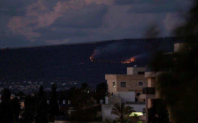 A fire burns on the occupied Palestinian border with Lebanon following explosions, Sunday, Oct. 15, 2023. (AP)