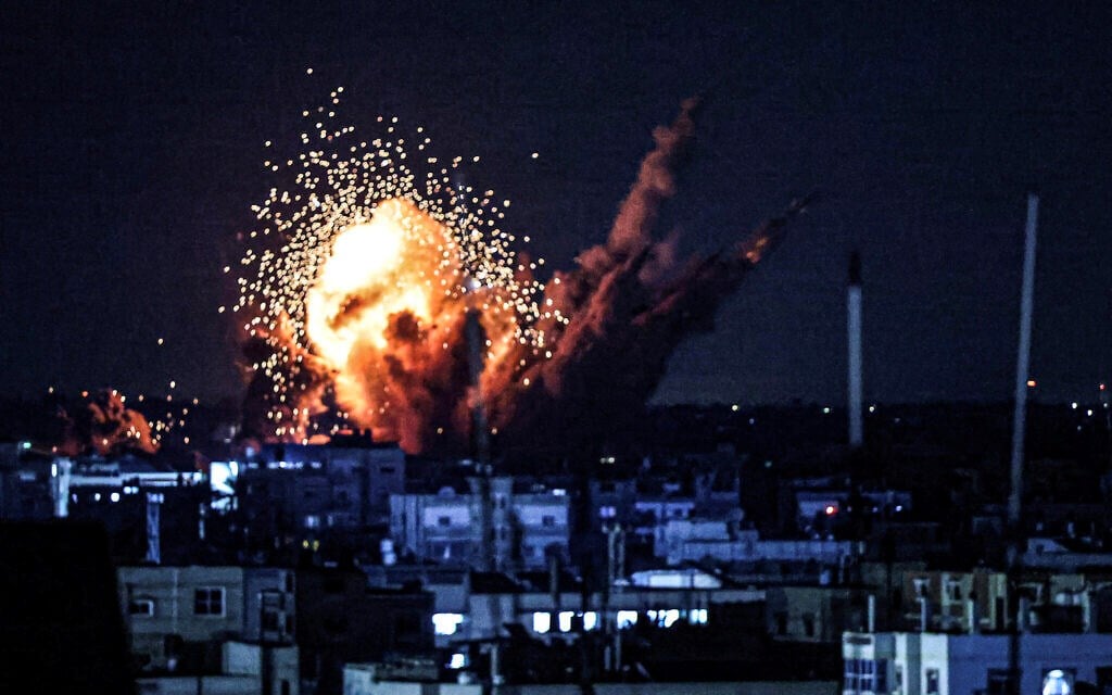 A ball of fire and smoke rise above buildings during an Israeli strike on Rafah in the southern Gaza Strip, on October 15, 2023. (AFP)