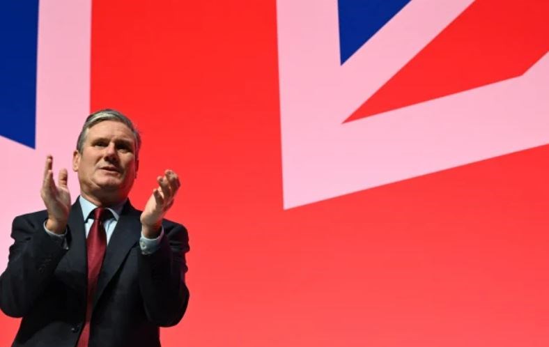 Britain’s main opposition Labour Party leader Keir Starmer applauds a speaker the final day of the annual Labour Party conference in Liverpool, northwest England, on October 11, 2023. (AFP via Getty Images)