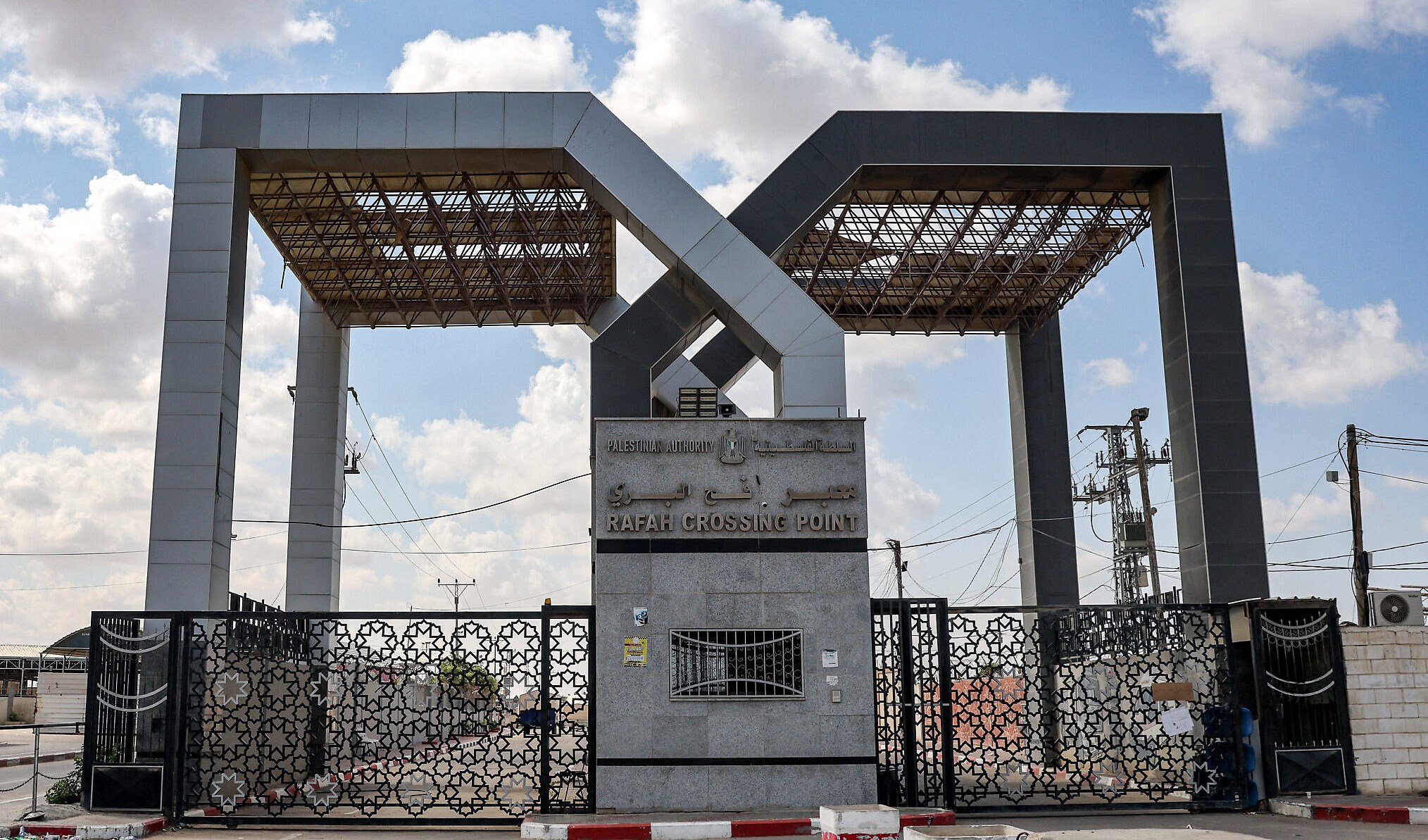 the closed gate to the Rafah border crossing with Egypt, in the southern Gaza Strip on Oct 19, 2023 (AFP)