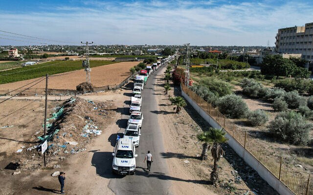 This aerial view shows humanitarian aid trucks arriving at a storage facility in Khan Younis in the southern Gaza Strip on October 21, 2023 after crossing the Rafah border (AFP)