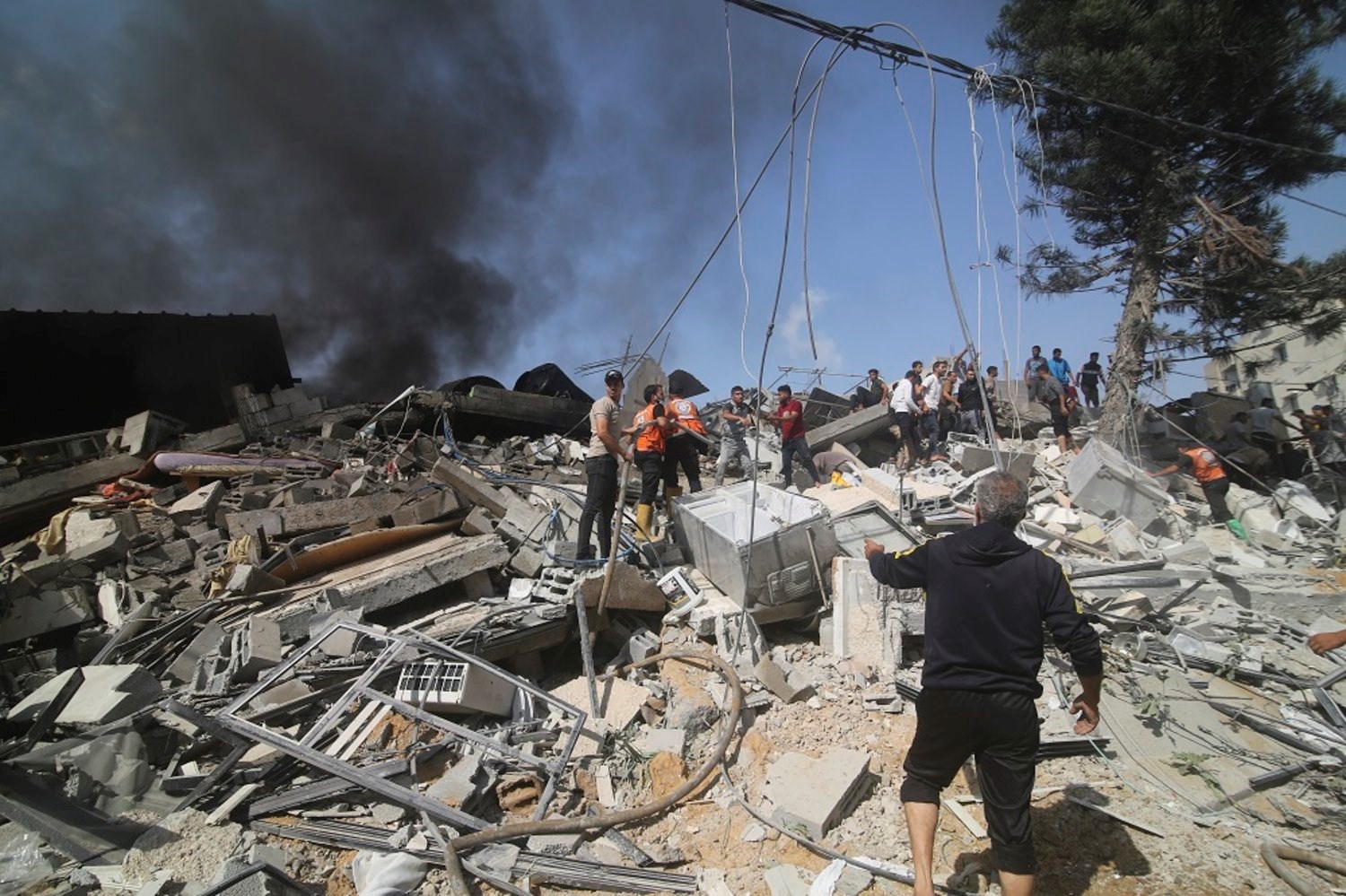 Palestinians look for survivors of the Israeli bombardment of the Gaza Strip in Rafah on Monday, Oct. 23, 2023. (AP)