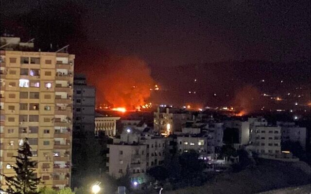 This image circulating online purports to show flames and smoke rising from a site in Damascus following an Israeli airstrike in Syria, early July 19, 2023. (Social media)