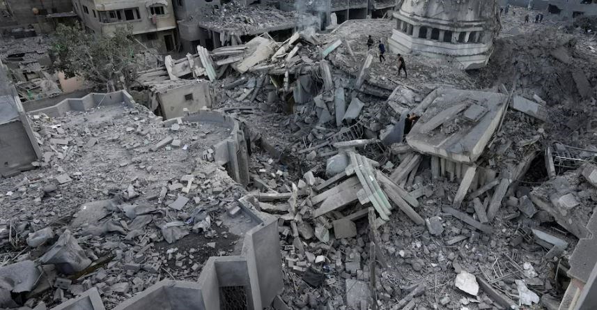 Palestinians inspect the rubble of the Yassin Mosque destroyed after it was hit by an Israeli airstrike at Shati refugee camp in Gaza City, early Monday, Oct. 9, 2023. (AP)