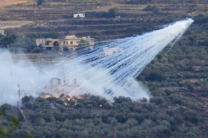 A shell from Israeli artillery explodes over a house in al-Bustan, a Lebanese border village with occupied Palestine, south Lebanon, Sunday, Oct. 15, 2023. (AP)