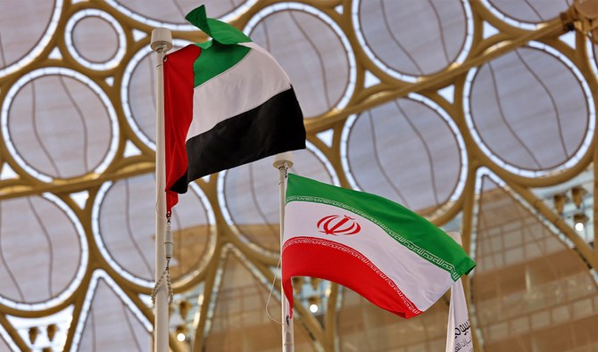The flags of United Arab Emirates and Iran are pictured during a national event at the Iranian Pavilion of Expo 2020, in the Gulf emirate of Dubai on February 7, 2022. (AFP)