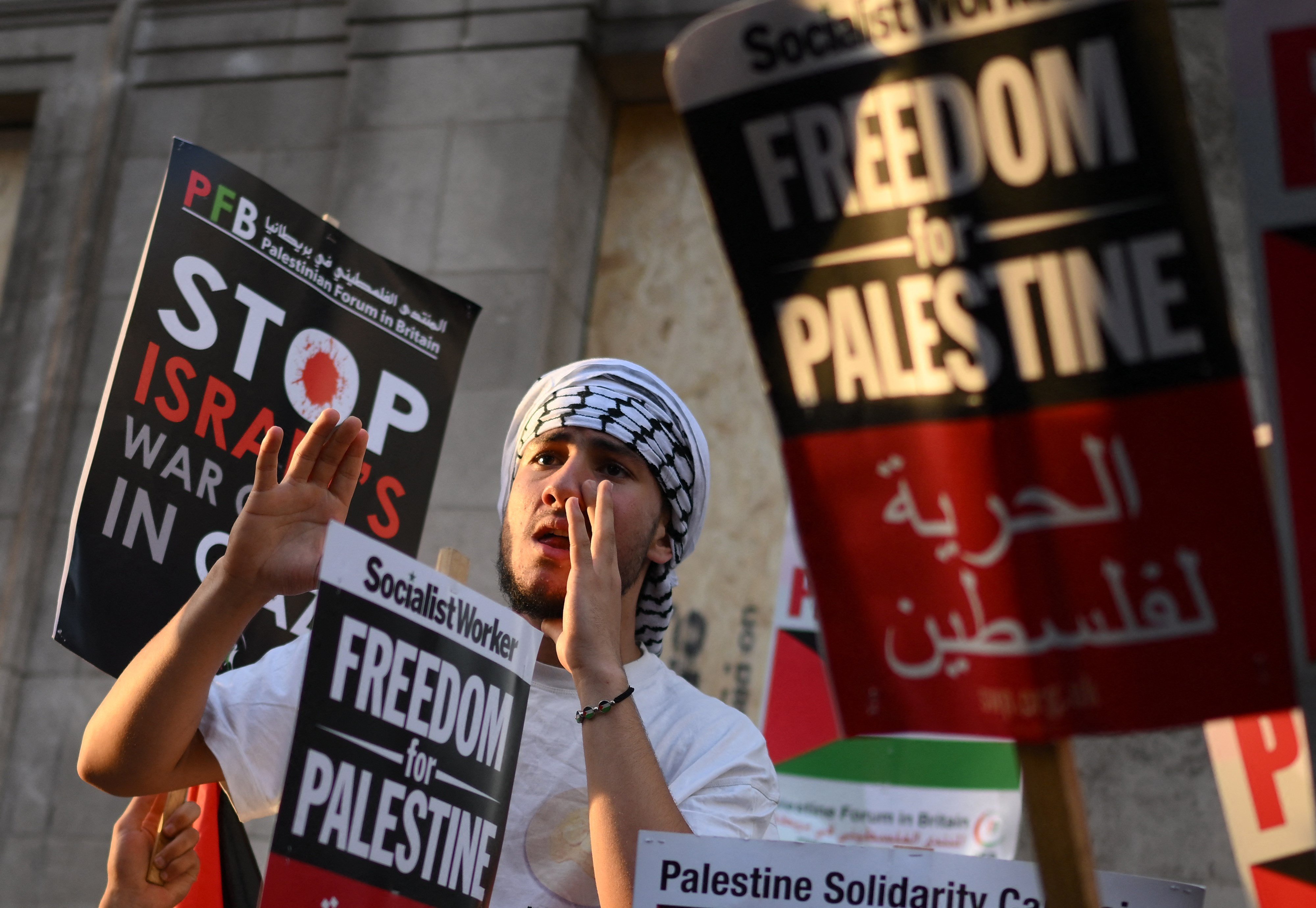 People take part in a 'Stand with Palestine' demonstration, close to the Embassy of Israel, in west London on October 9, 2023. (Photo by Daniel LEAL / AFP)