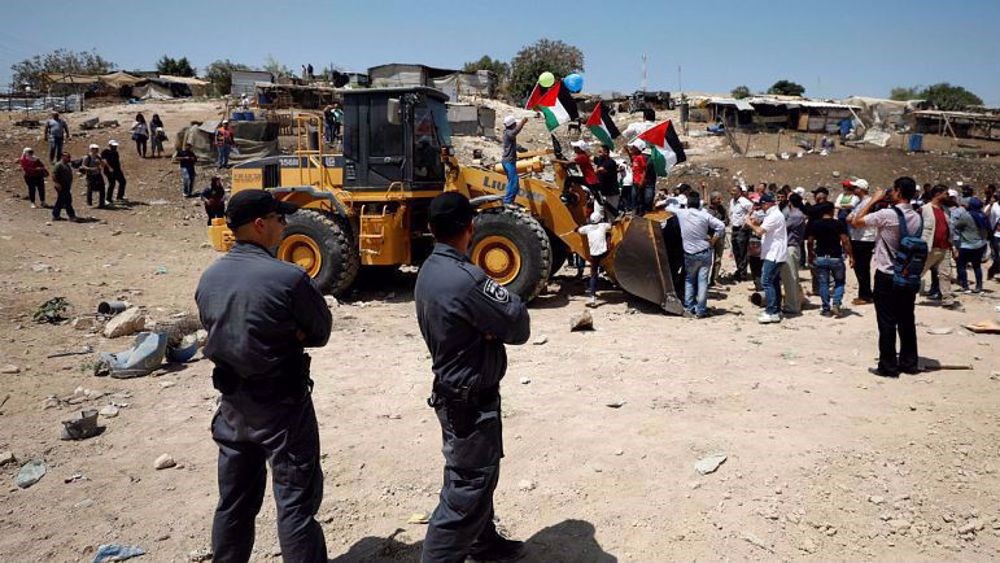 Palestinians protest and block Israeli soldiers from demolishing Khan al-Ahmar village. (Reuters)