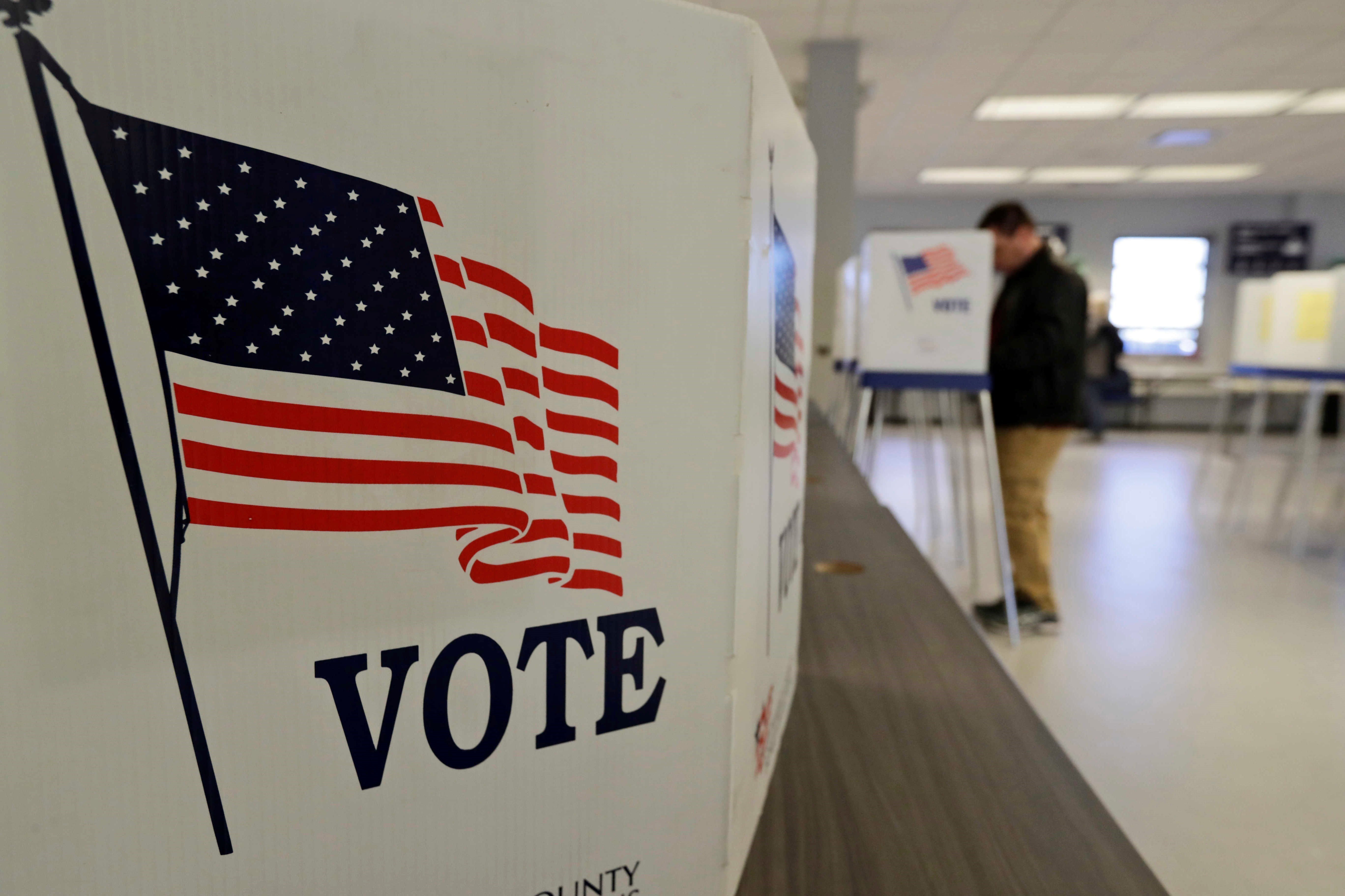A man votes during early election in Cleveland March 30, 2020 (AP).