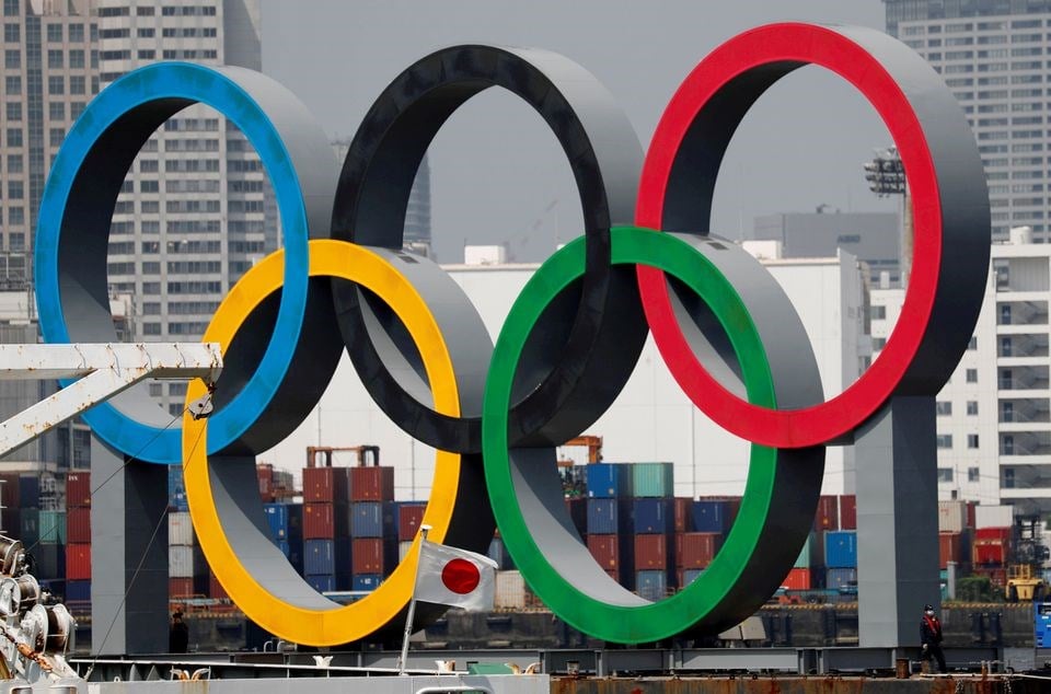 Giant Olympic rings are seen behind Japan's national flag (REUTERS)