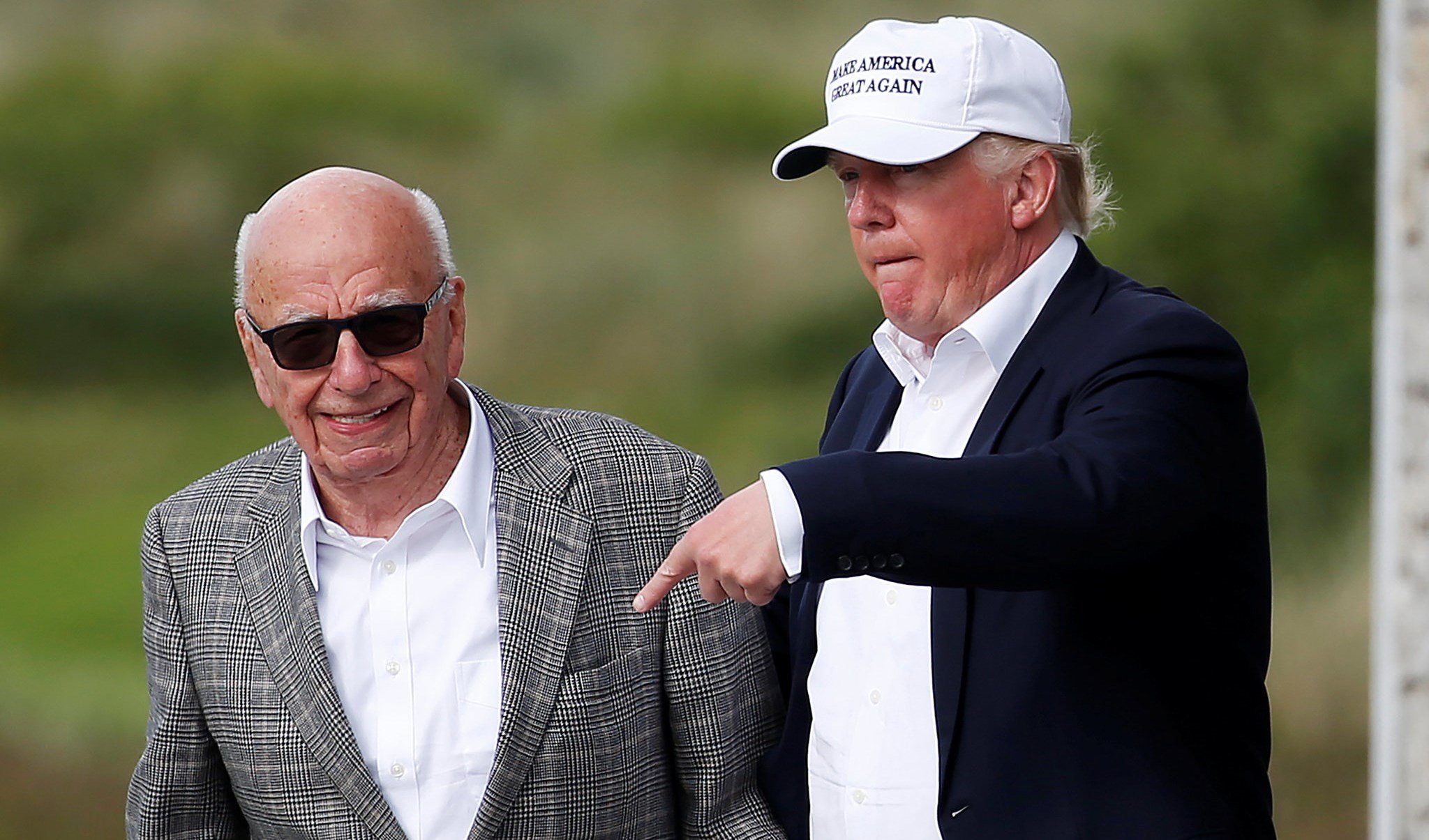 Billionaire Rupert Murdoch and former US president Donald Trump at the latter's Golf Links court in 2016 (Reuters)