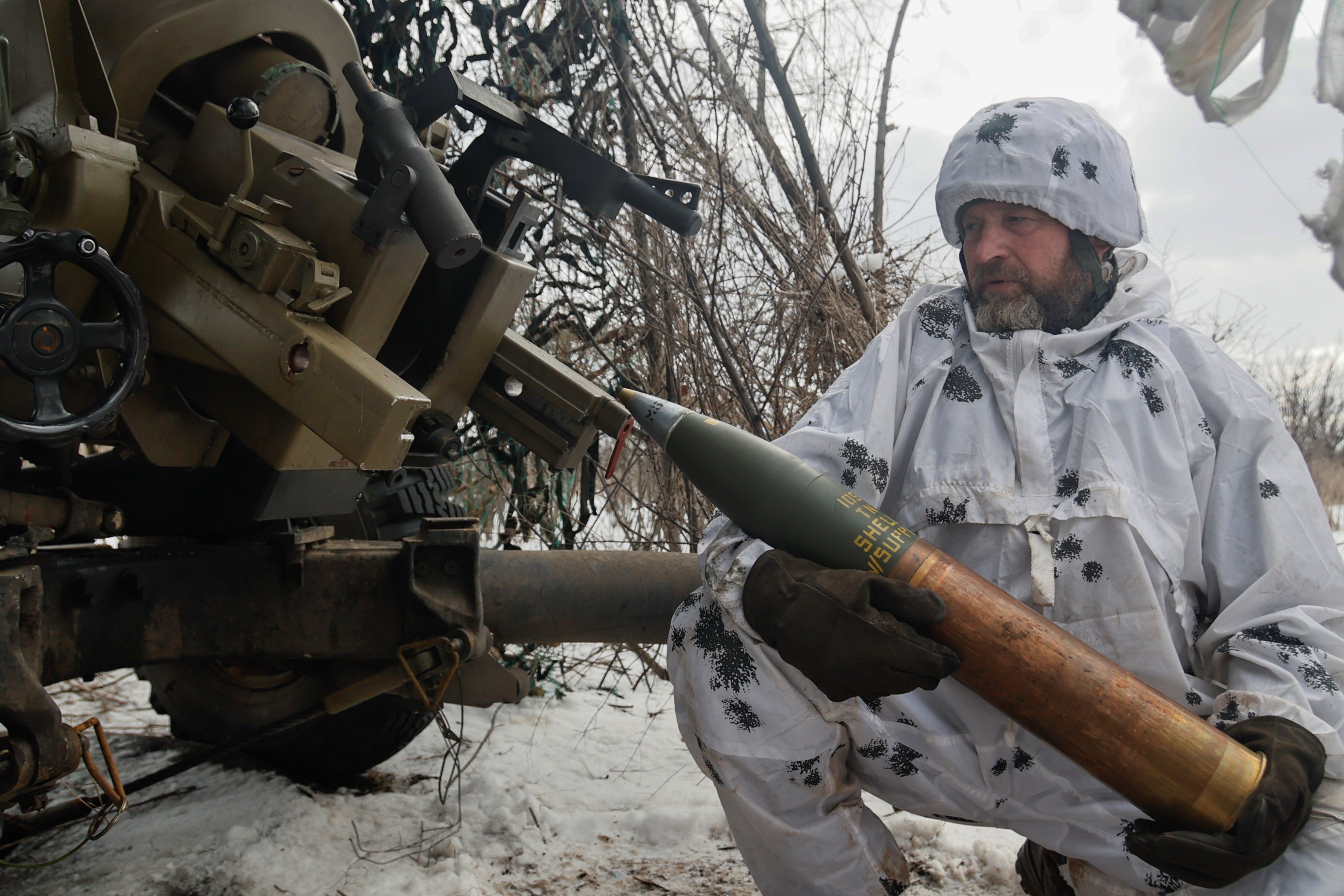 A Ukrainian soldier prepares to fire an artillery at Russian positions near Bakhmut, Donetsk region, Ukraine, Wednesday, Feb. 15, 2023 (AP).