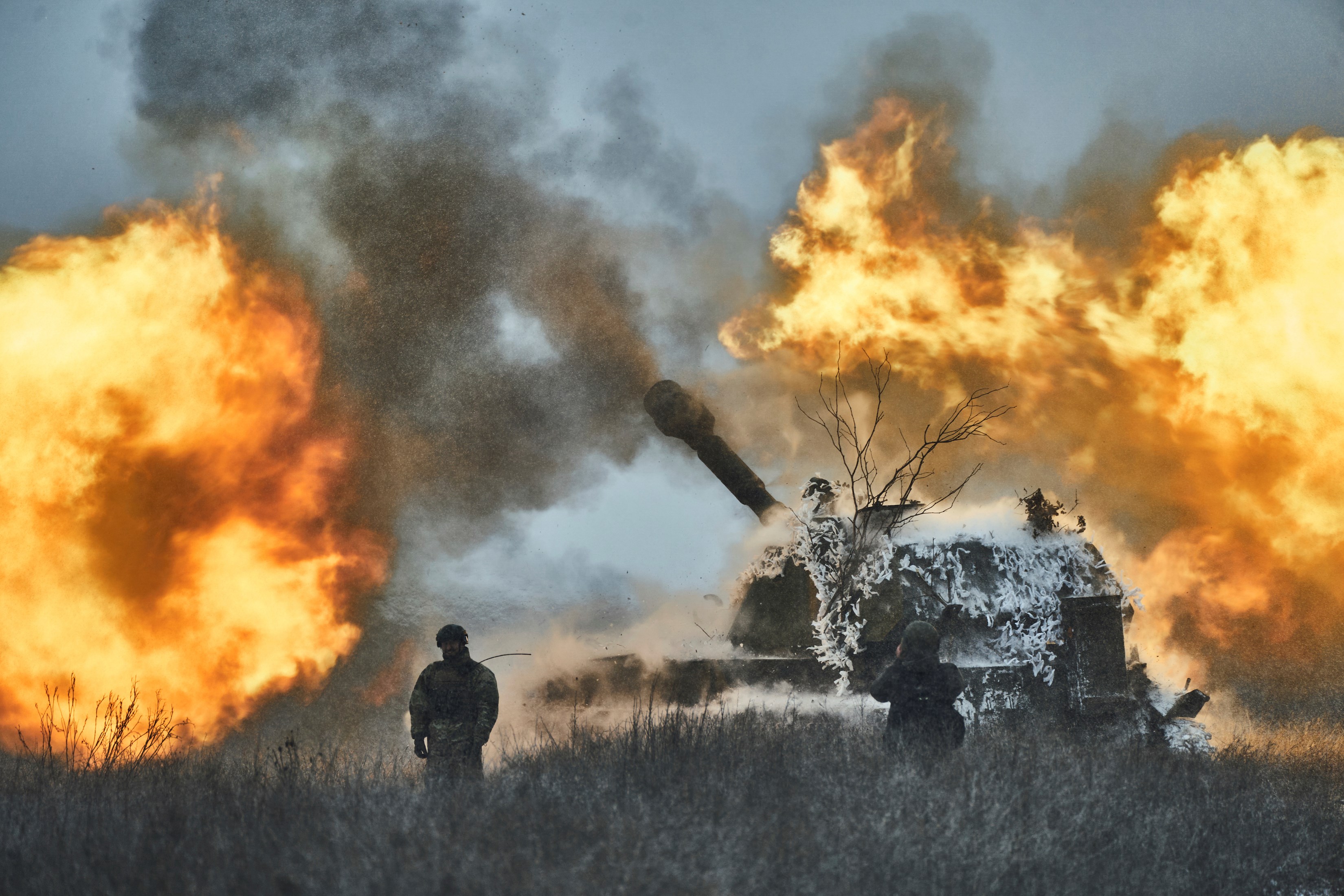 Ukrainian soldiers fire a self-propelled artillery vehicle on the frontline, Donetsk region, Saturday, Feb. 18, 2023. (AP Photo/Libkos)
