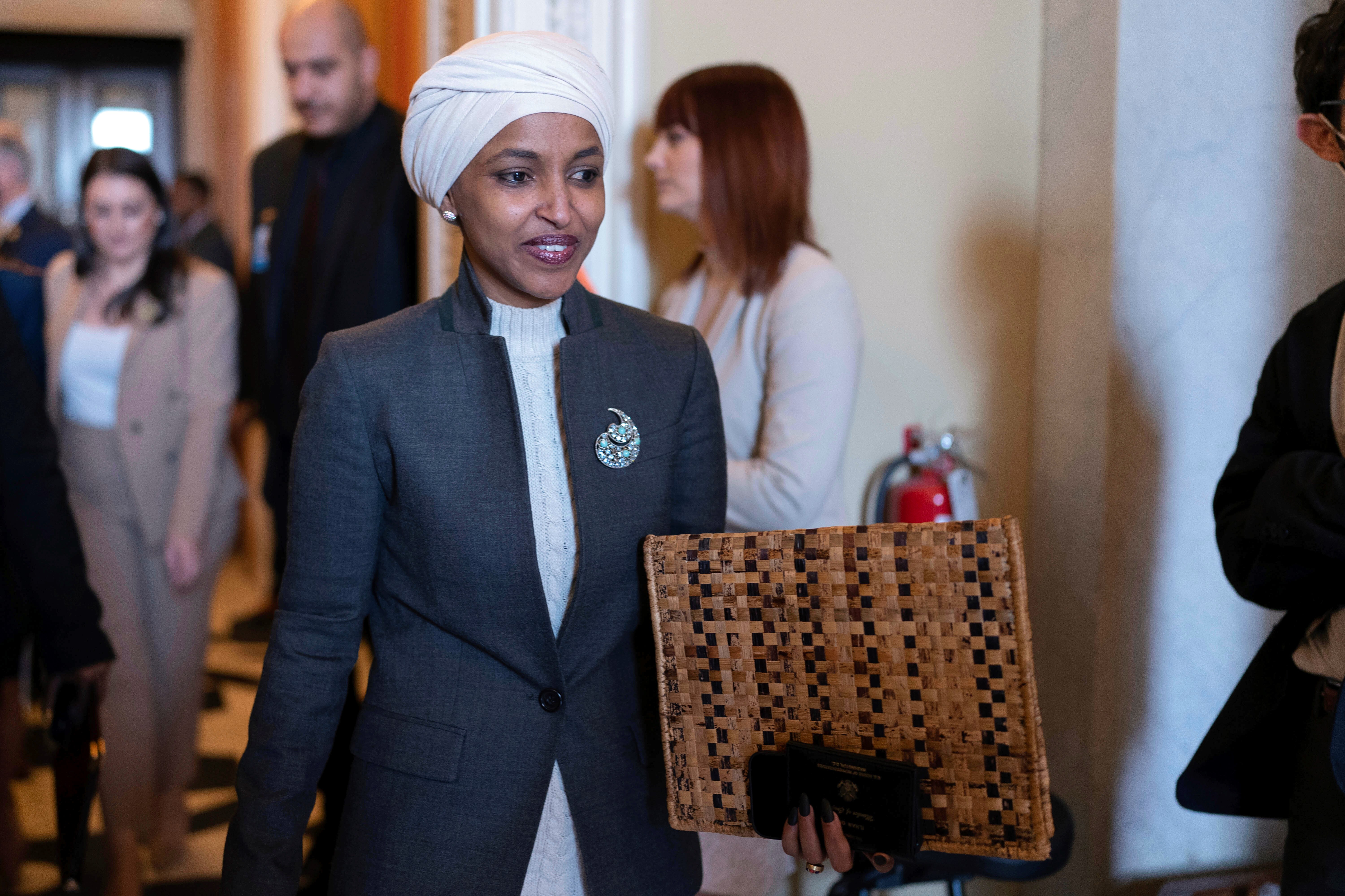 Rep. Ilhan Omar, D-Minn., leaves the House chamber at the Capitol in Washington, Thursday, Feb. 2, 2023. House Republicans have voted to oust Omar from the House Foreign Affairs Committee (AP Photo/Jose Luis Magana)