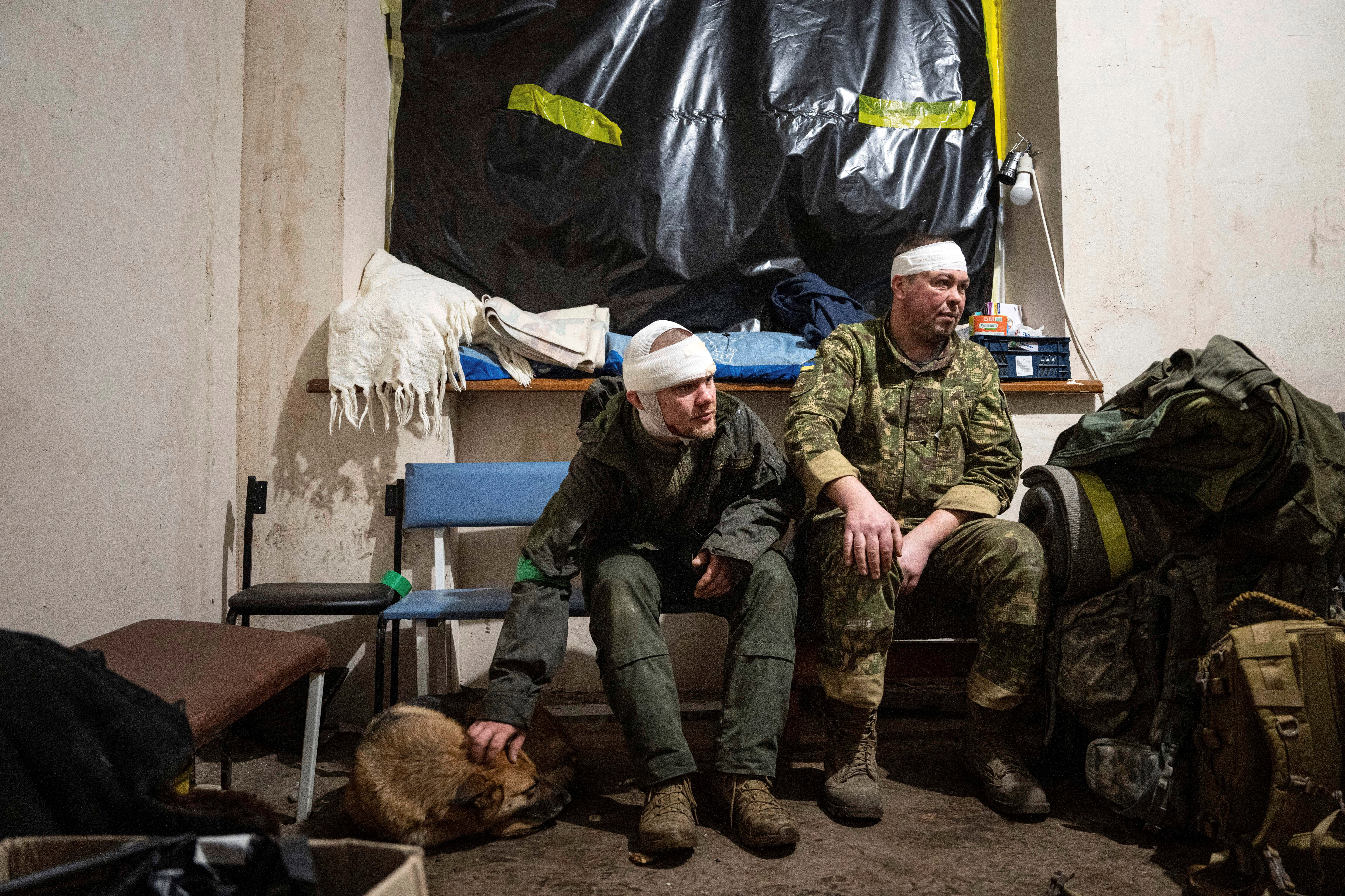 Ukrainian servicemen who were wounded at the battlefield wait to leave the field hospital near Bakhmut, Donetsk region, Sunday, Feb. 26, 2023 (AP Photo/Evgeniy Maloletka)