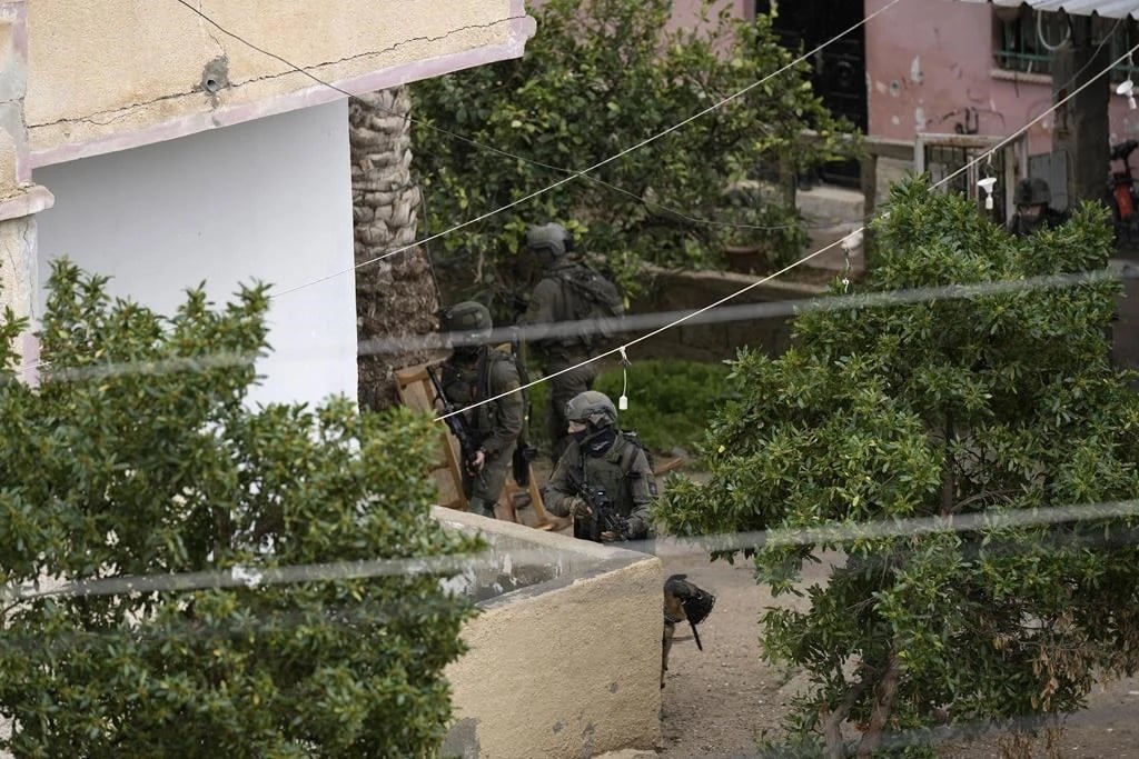 The IOF raiding Aqabat Jaber camp on Saturday, Feb. 4, 2023 (AP)