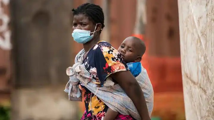 A child with cholera is being carried by his mother in central Malawi, on Jan. 11, 2023.  (AP)
