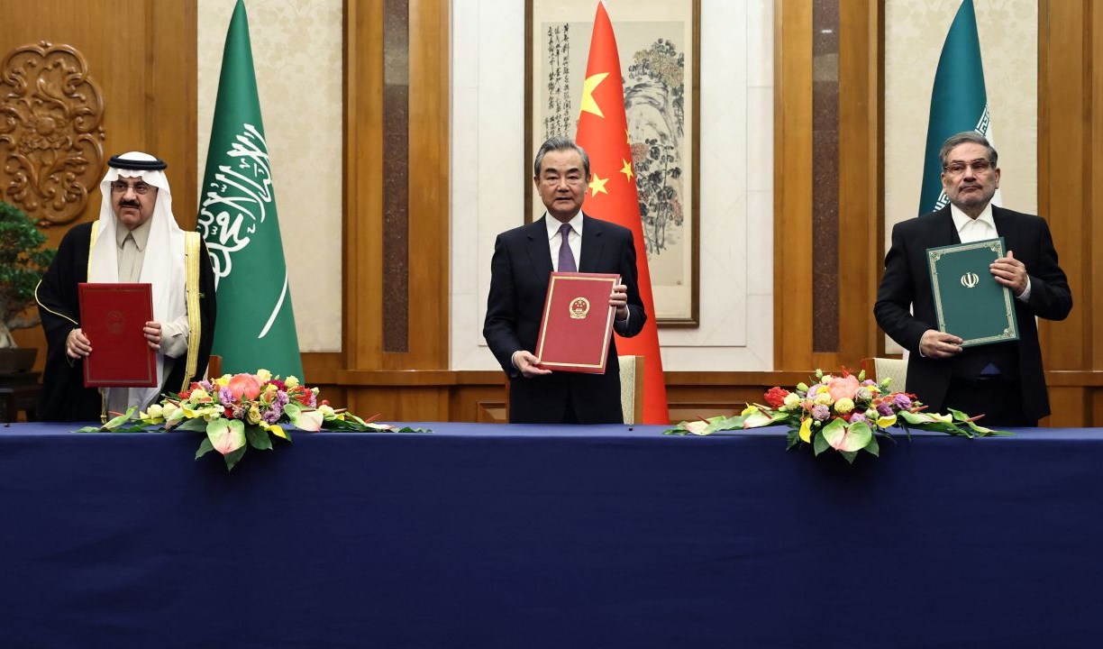 Wang Yi, China's top diplomat, with Secretary of Iran's Supreme National Security Council Ali Shamkhani and national security adviser of Saudi Arabia Musaad bin Mohammed Al Aiban in Beijing on March 10, 2023 (Reuters).