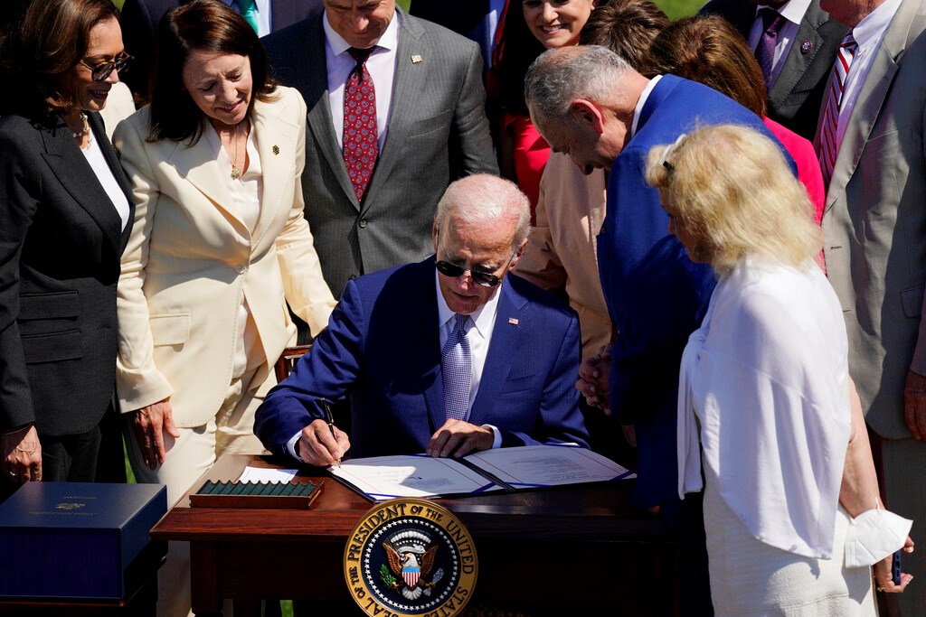 President Joe Biden signs into law H.R. 4346, the CHIPS and Science Act of 2022, at the White House in Washington, Aug. 9, 2022 (AP /Carolyn Kaster)