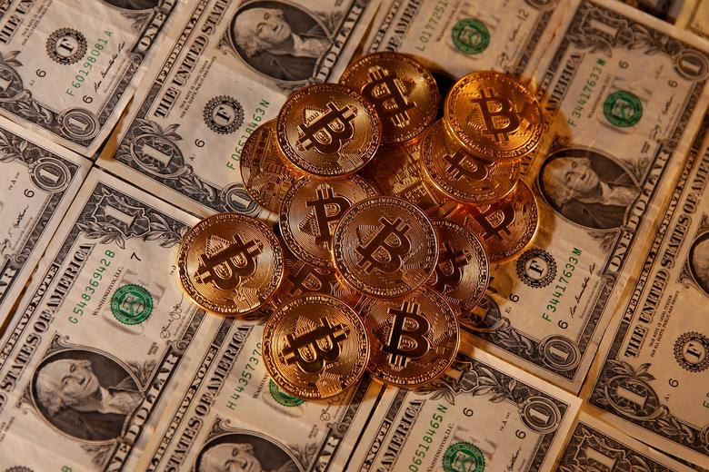 Representations of virtual currency Bitcoin and U.S. dollar banknotes are seen in this picture illustration taken January 27, 2020 (Reuters).