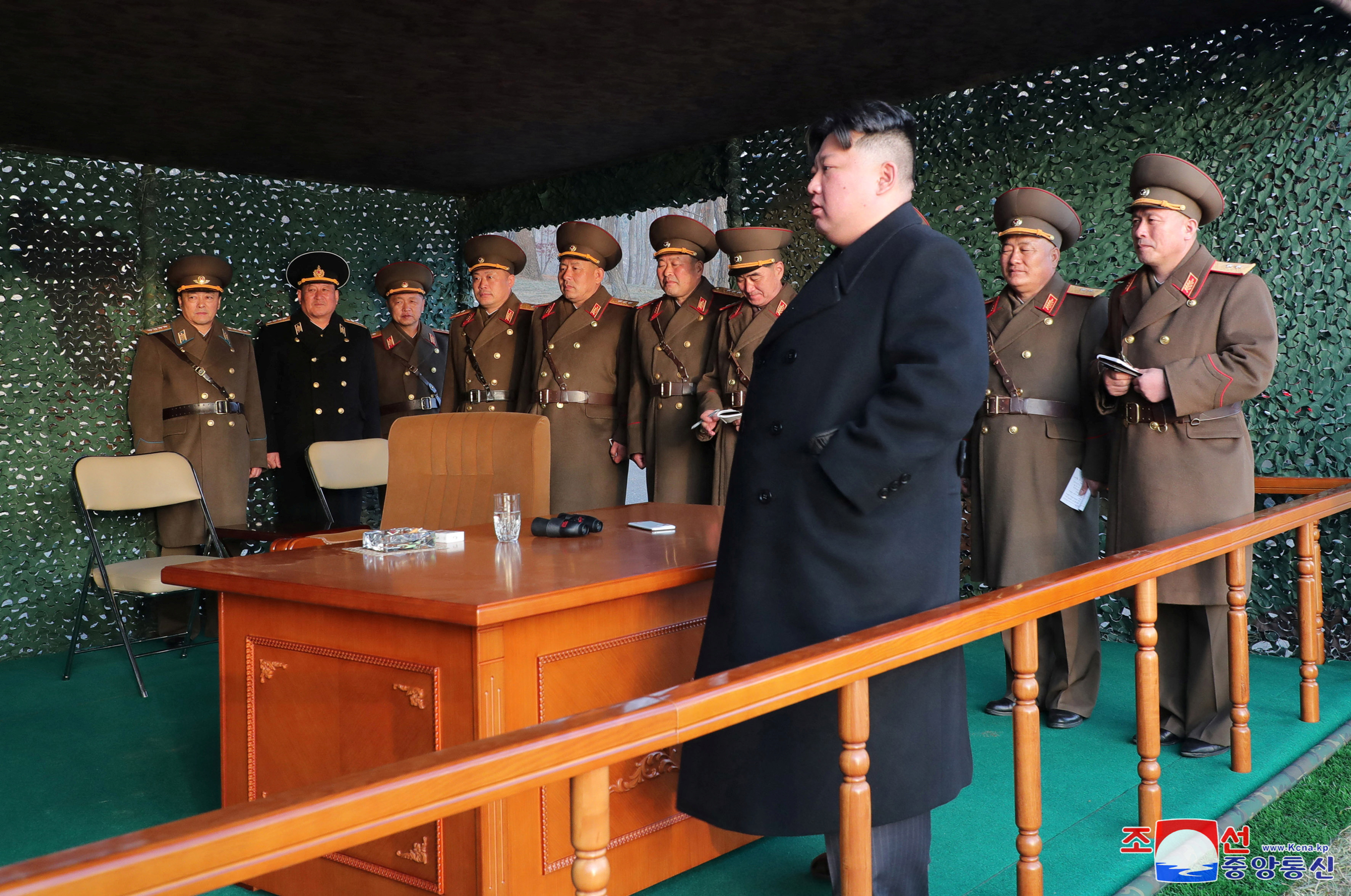 Democratic People's Republic of Korea leader Kim Jong Un watches fire assault drill, at an undisclosed location in North Korea March 10, 2023 (KCNA via Reuters).
