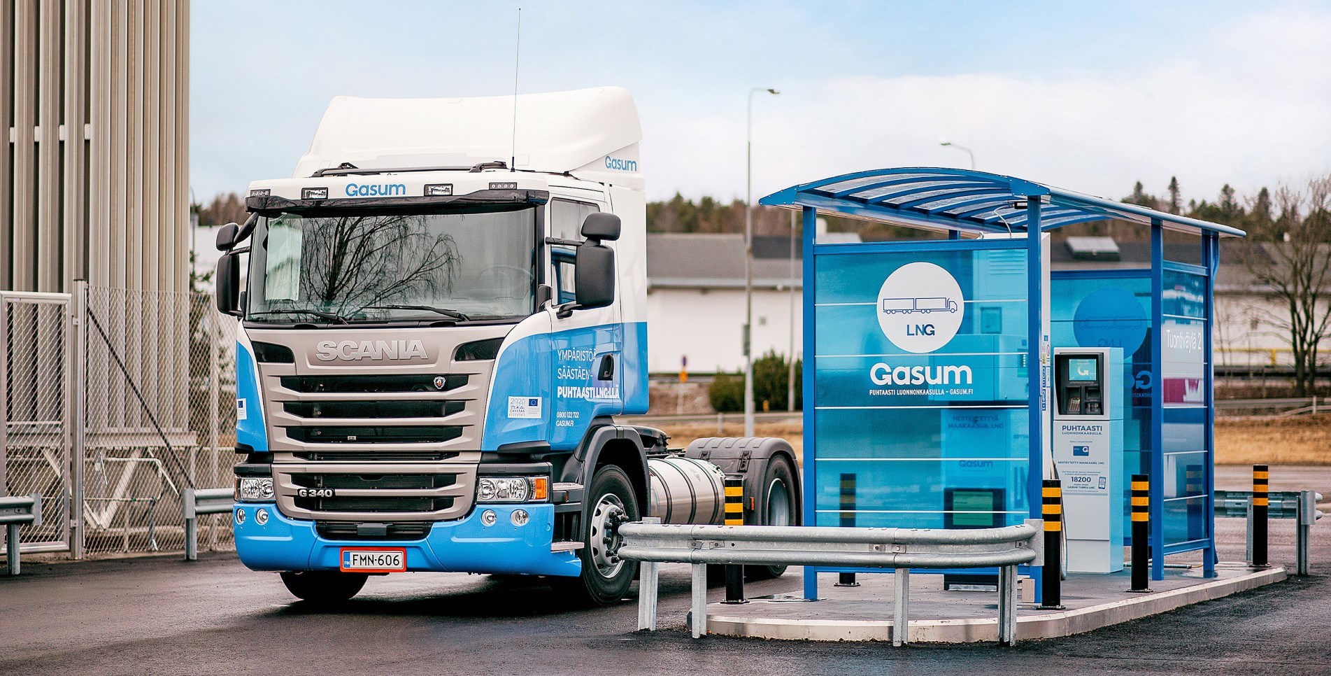 An image of a truck pertaining to the Gasum company in Finland near a gas pump in an undated photo (Gasum)