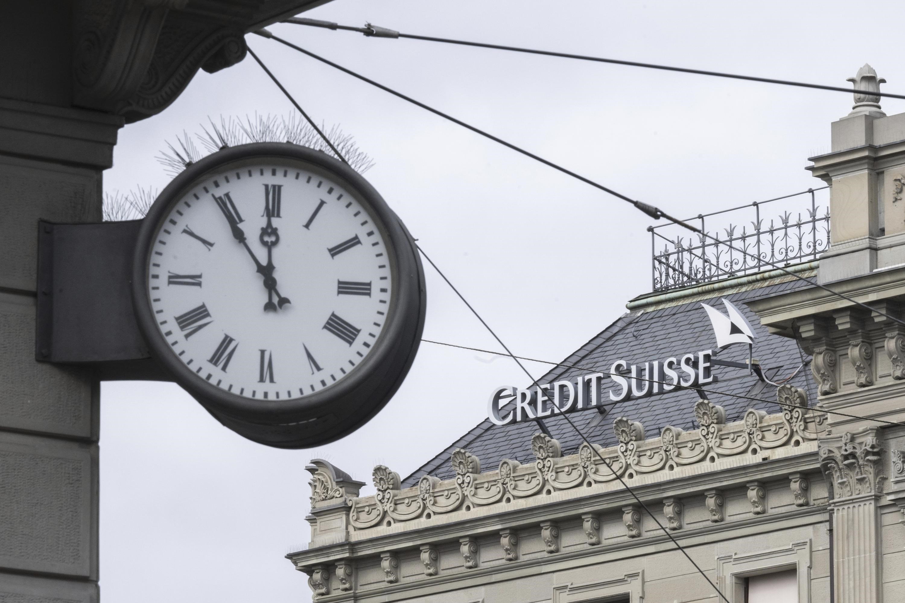 A clock is seen near the Swiss bank Credit Suisse in Zurich on March 20, 2023 (AP)