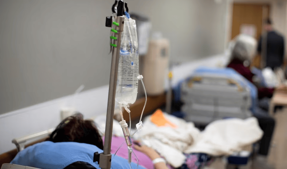 Patients are held in the hallway as St. Mary Medical Center resorts to using tents outside to handle the overflow at its 200 bed hospital during the outbreak of the coronavirus disease in Apple Valley, California, US, January 12, 2021 (AP).