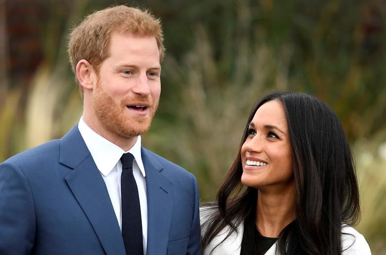 Prince Harry poses with Meghan Markle in the Sunken Garden of Kensington Palace. (Reuters)