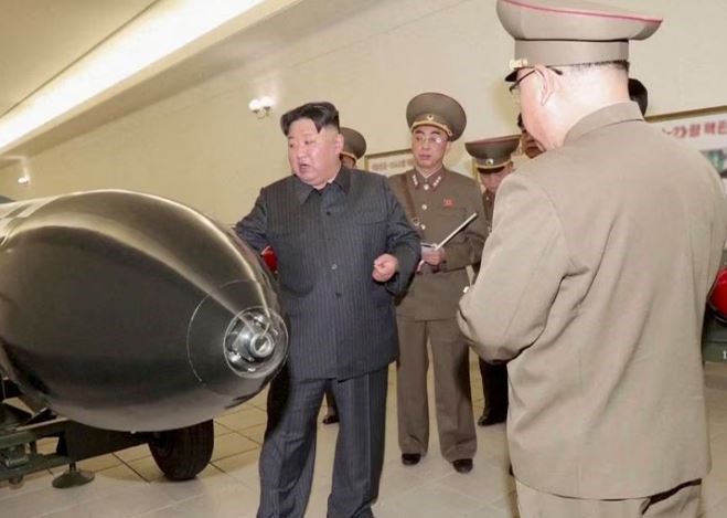 A screen grab shows North Korean leader Kim Jong Un inspecting nuclear warheads at an undisclosed location in this undated still image used in a video. (Reuters)