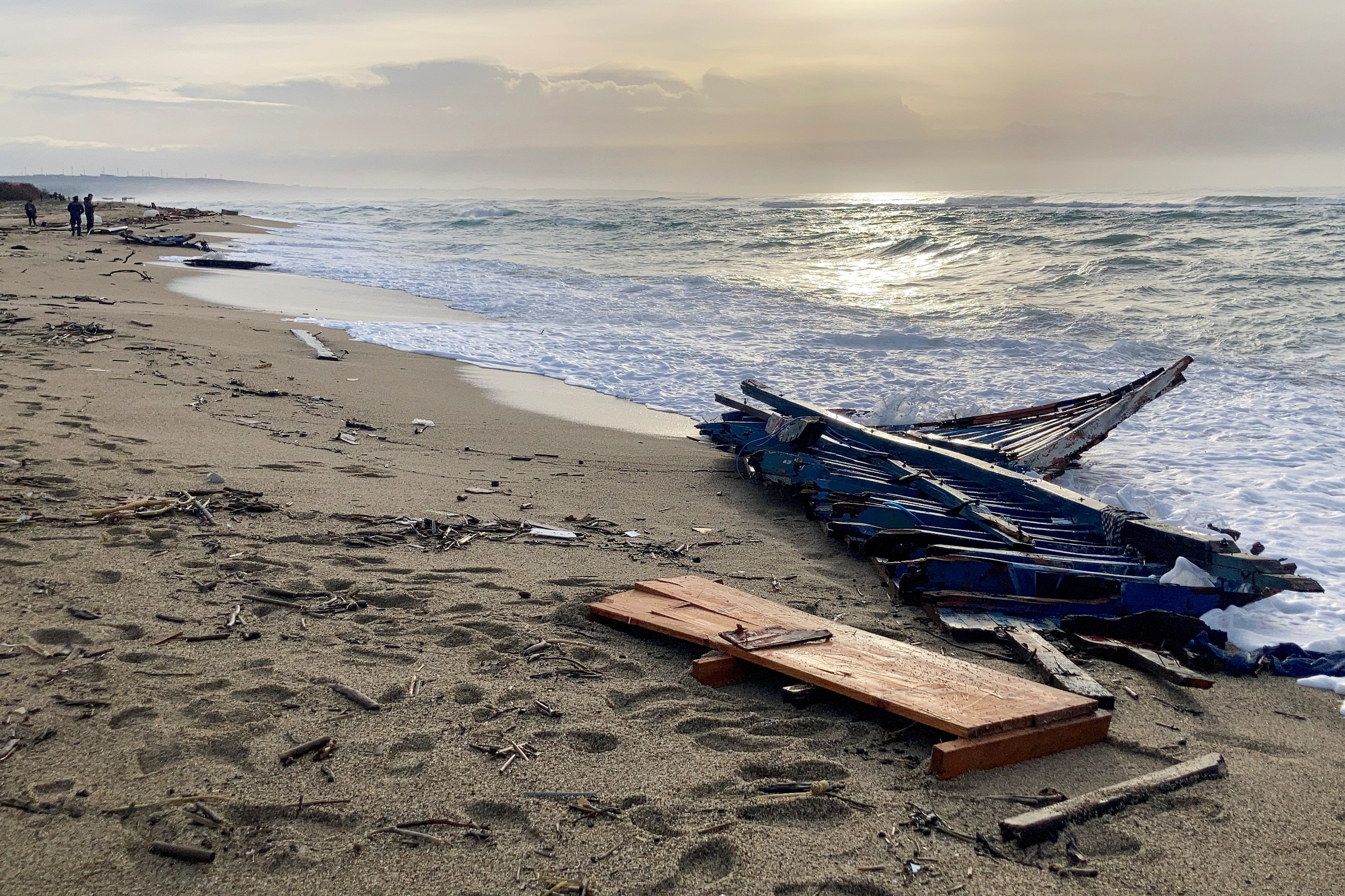 A view of part of the wreckage of a capsized boat that was washed ashore at a beach near Cutro, southern Italy, on Feb. 27, 2023. (AP)