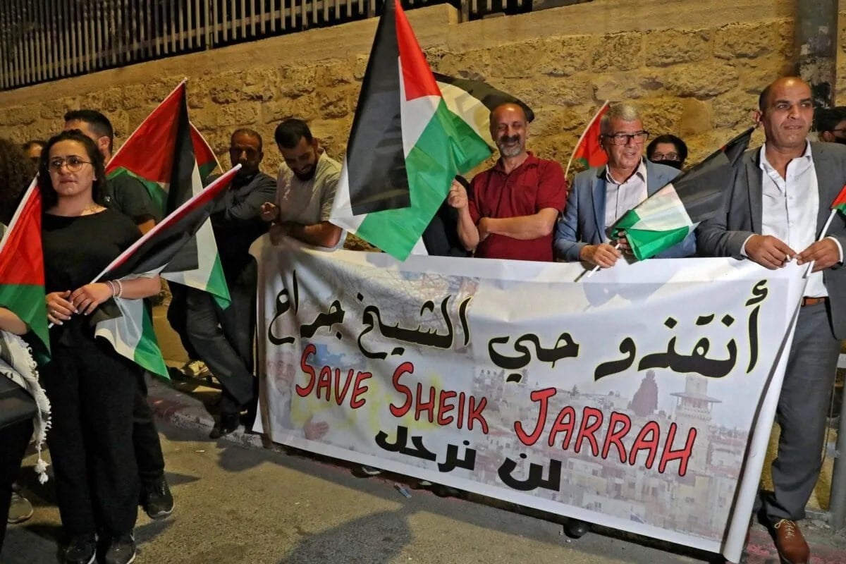 Palestinians in the occupied West Bank stage a protest in solidarity with Palestinian residents of Sheikh Jarrah neighborhood on May 10, 2021. (AFP)