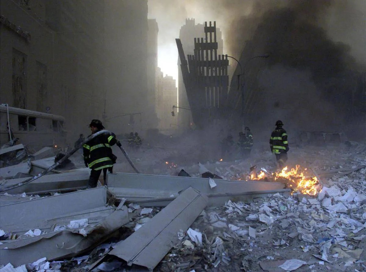 Firefighters work around the World Trade Center after both towers collapsed in New York on September 11, 2001. (Reuters)