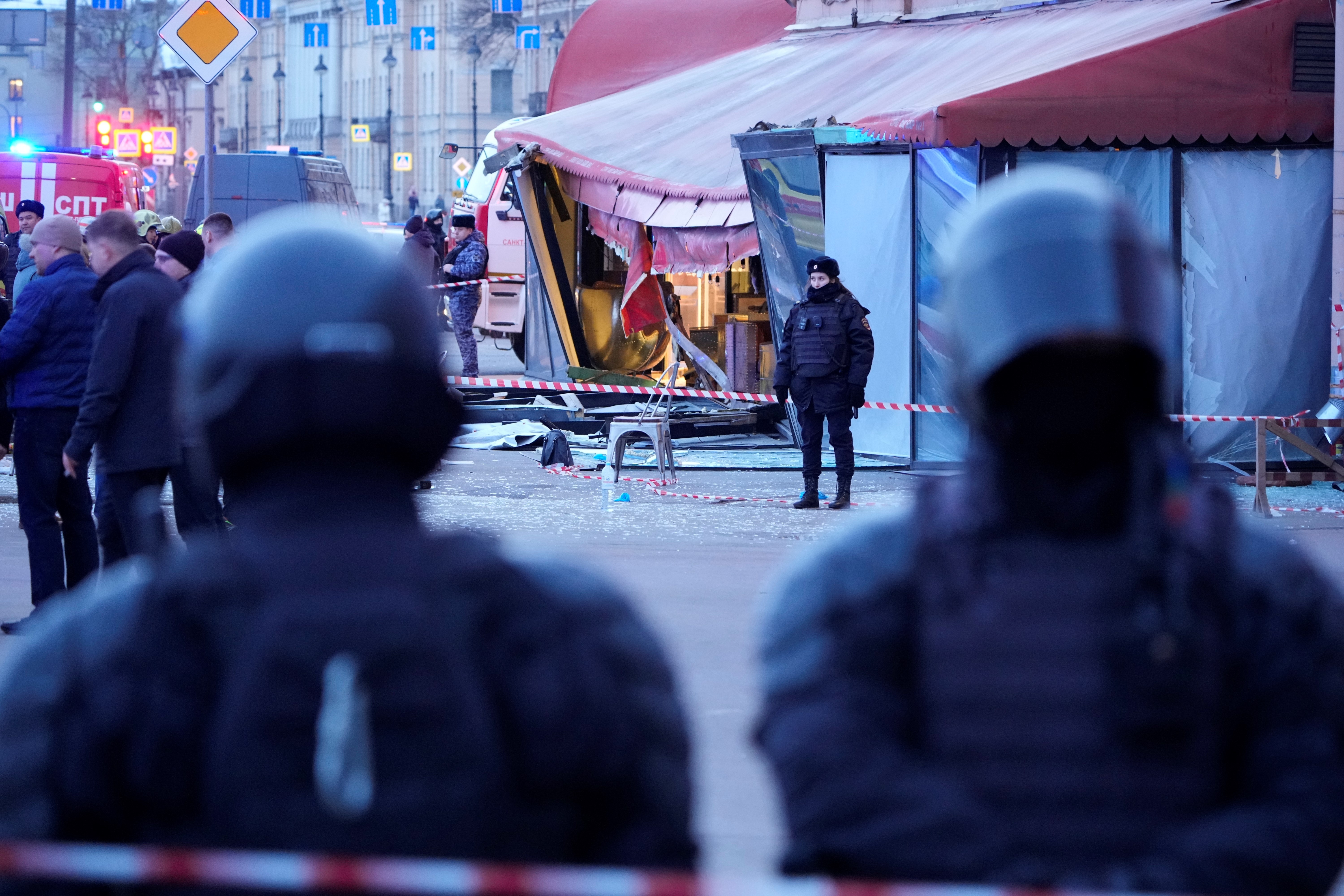 Russian police officers are seen at the site of an explosion at a cafe in St. Petersburg, Russia, Sunday, April 2, 2023 (AP Photo)