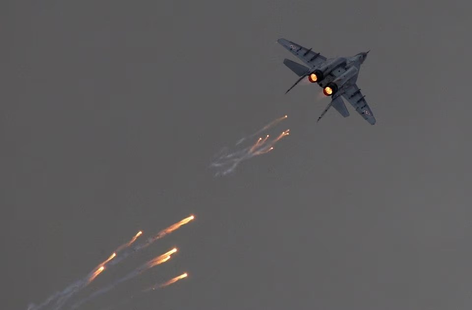A Polish Air-Force MiG-29 sends out flares in a performance at the Radom Air Show, 24 August 2013. (Reuters)