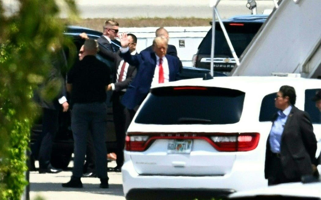 Former US President Donald Trump before he boards his plane in Florida, bound for New York (AFP)