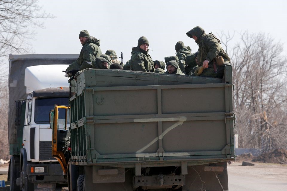 Russian troops riding in a truck near the city of Mariupol, Russia. 21 March 2022. (Reuters)