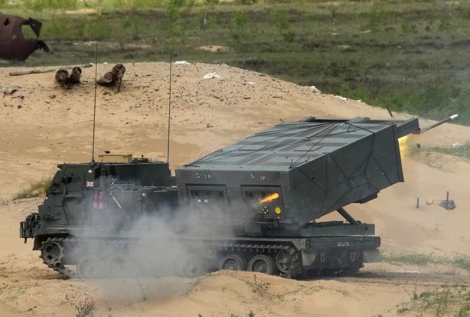 The British army M270 (MLRS) system fires rockets at targets during 'Summer Shield' 2022 military exercise in Adazi, Latvia, 27 May 2022. (Reuters)