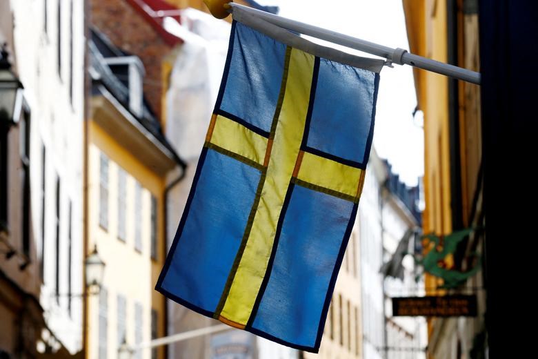 The Swedish flag is seen at Gamla Stan, the Old City of Stockholm, Sweden, May 7, 2017. (REUTERS)