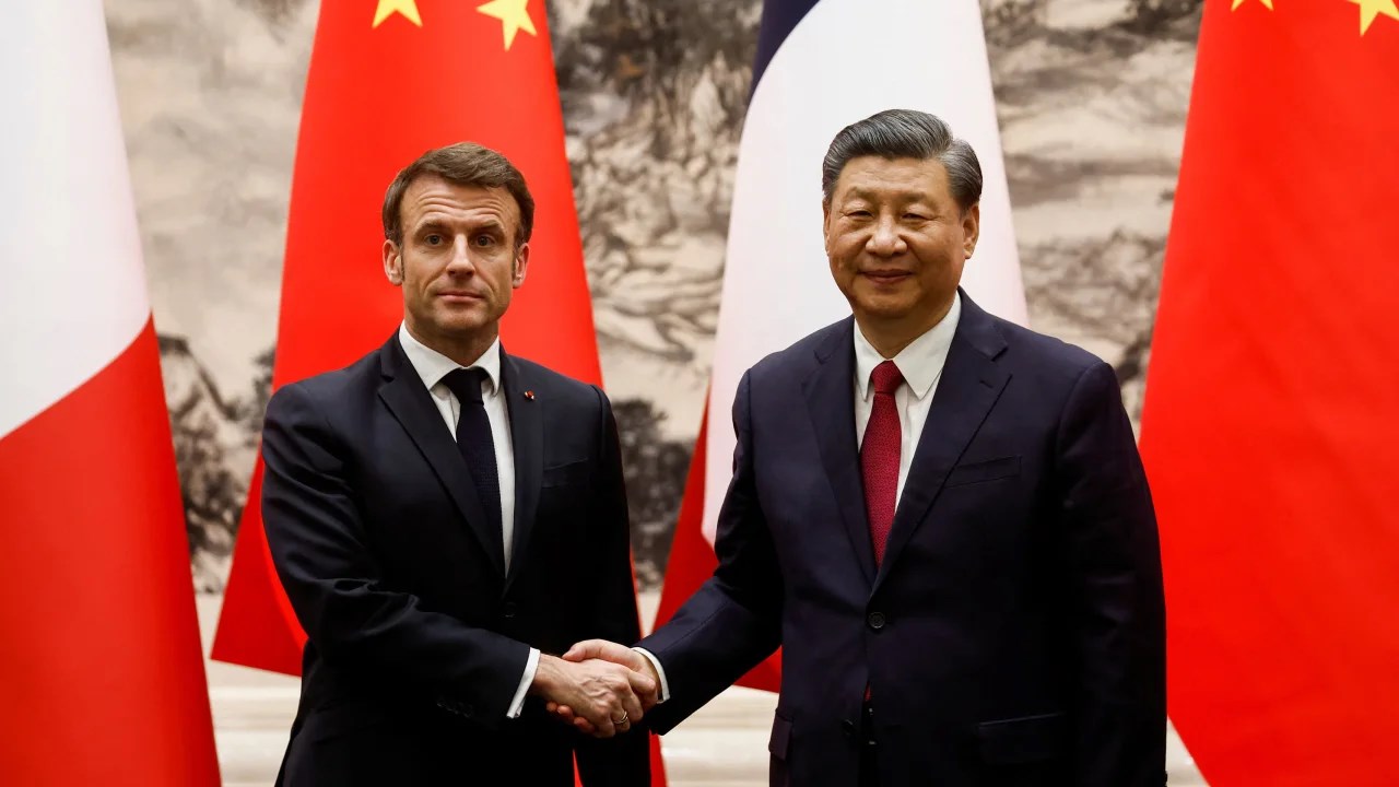 Xi and Macron shake hands at a signing ceremony at the Great Hall of the People. (Reuters)
